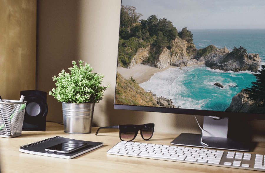 Design studio computer with Big Sur image on screen - R-TDesign.com